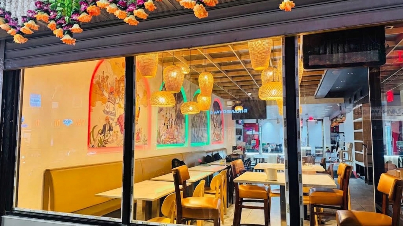 Interior seating and mural wall at Desi Dhamaka Jersey City