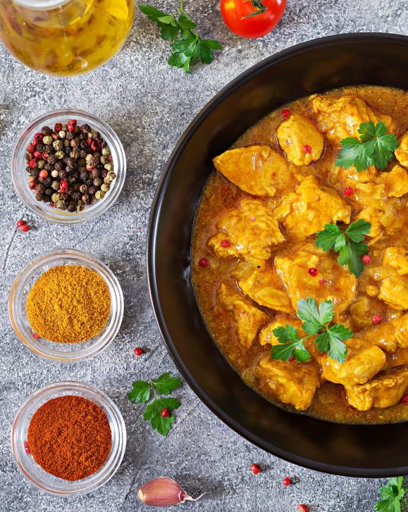 Curry with chicken and onions Indian food Asian cuisine Top view